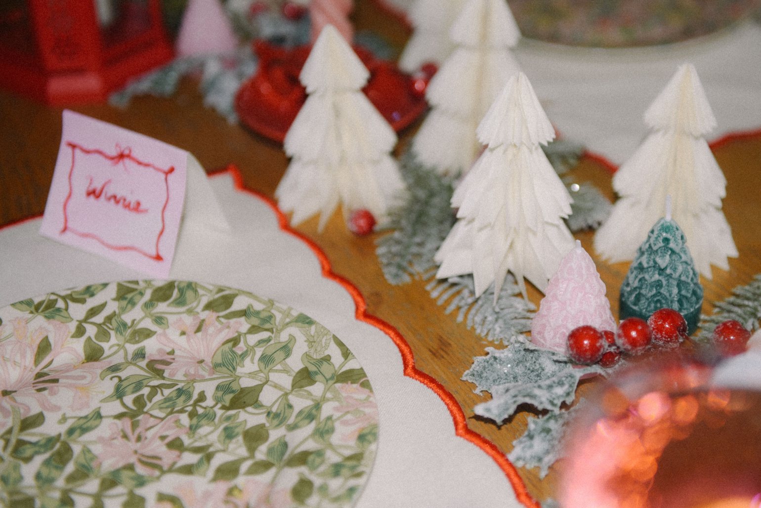 White Christmas trees and floral plate on dining table